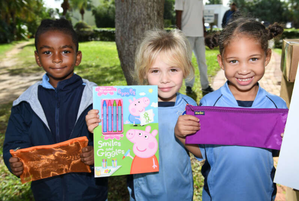 Support Public Schools Bermuda delivers school supplies to St George's Preparatory School. Pictured: Marcelo Robinson, left, Laila Frith, Amia Simons-Hall (Photograph by Akil Simmons)
